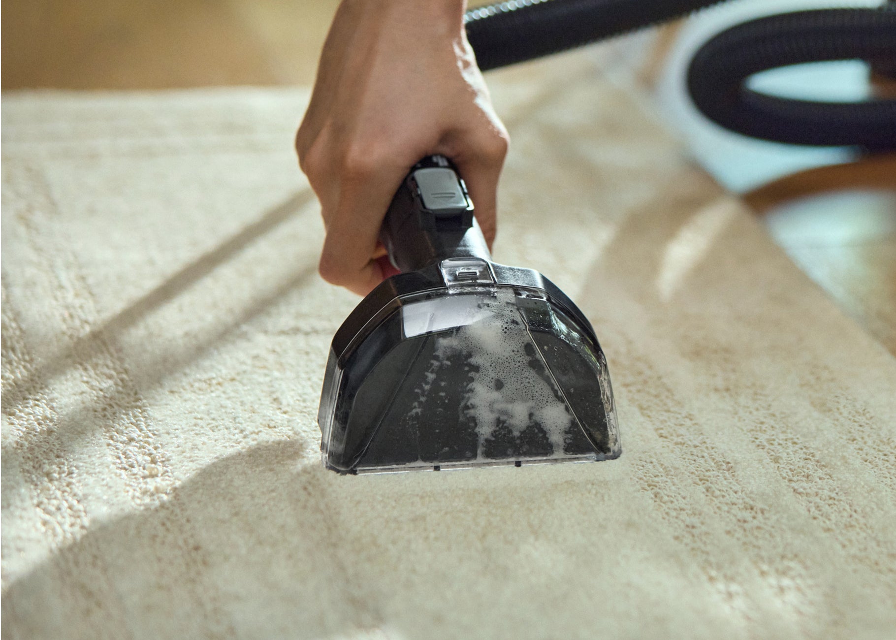 Using 6 inch tool to deep clean stain on area rug
