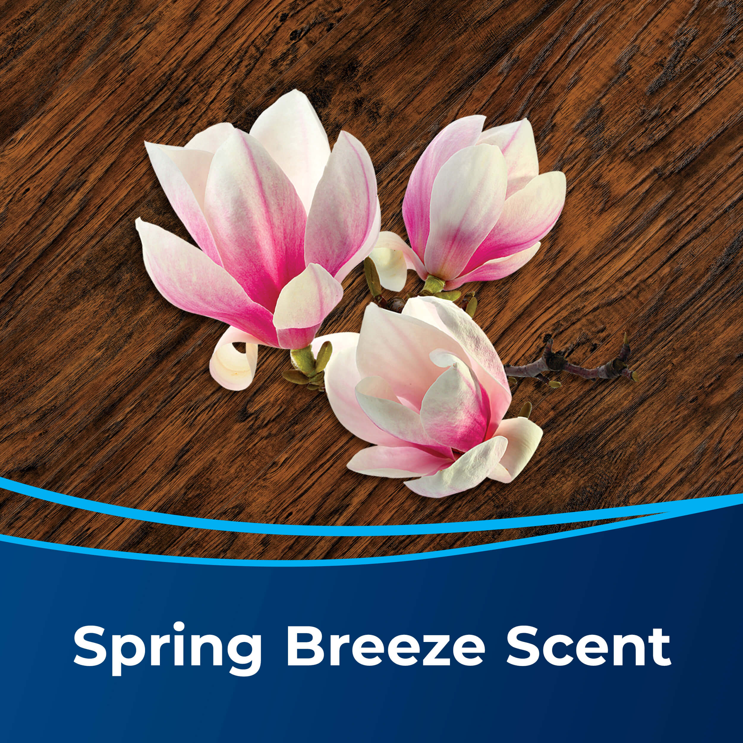 Flowers on Wood Floor. Text: Spring Breeze Scent.