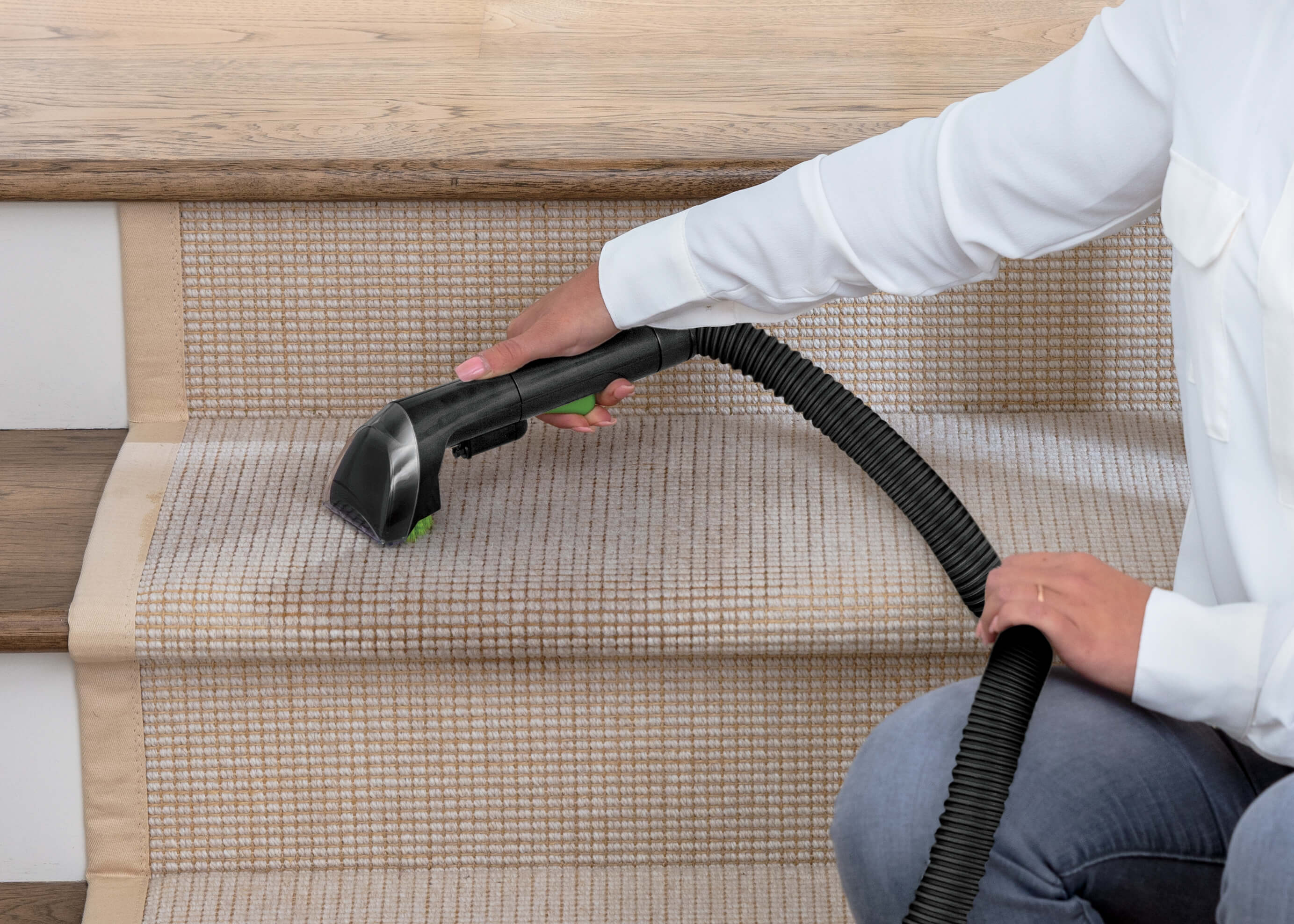 Using Portable Machine to clean Carpet on Stairs.