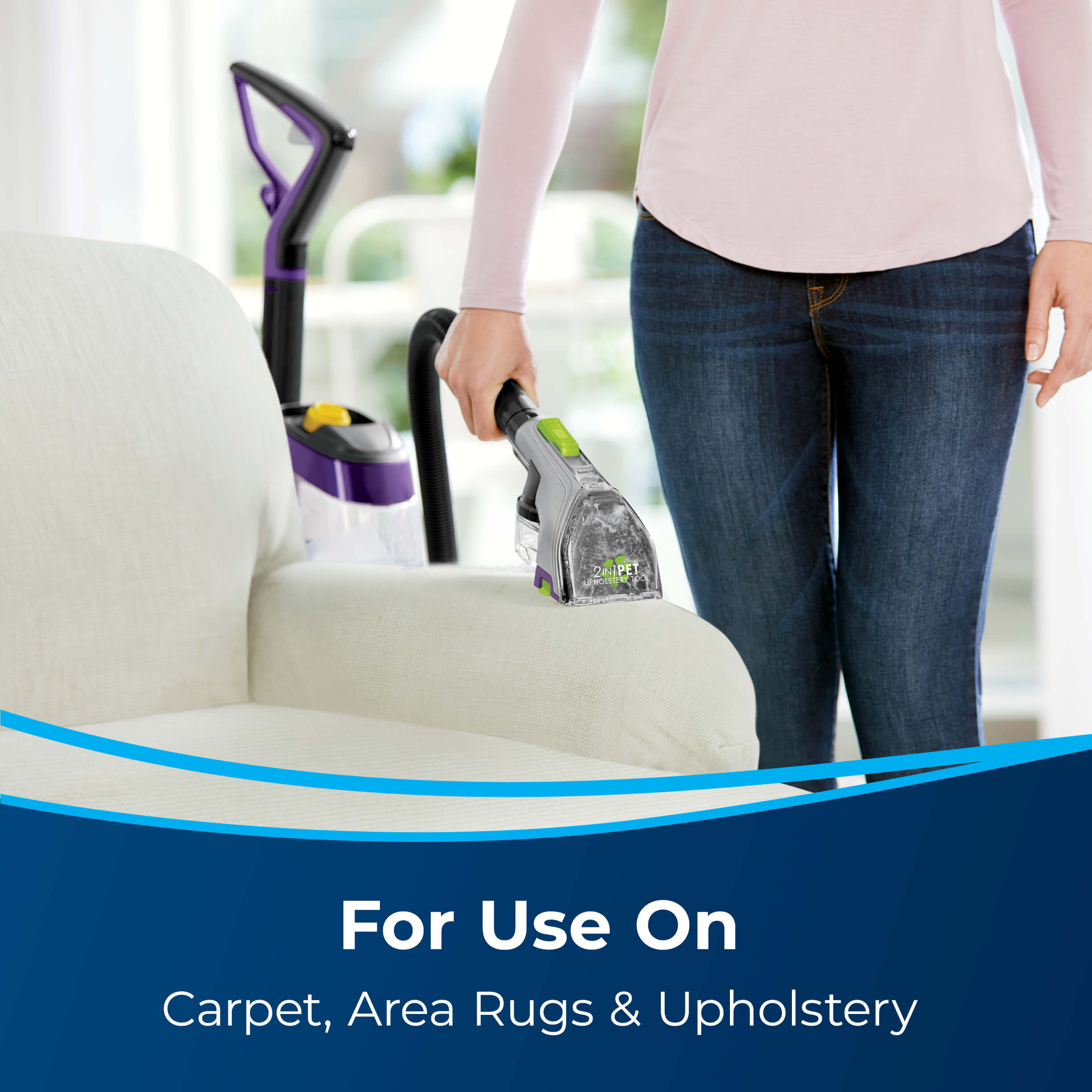 Using Hose of Carpet Cleaner to Clean Couch Cushion.
                        Text: For Use On Carpet, Area Rugs & Upholstery