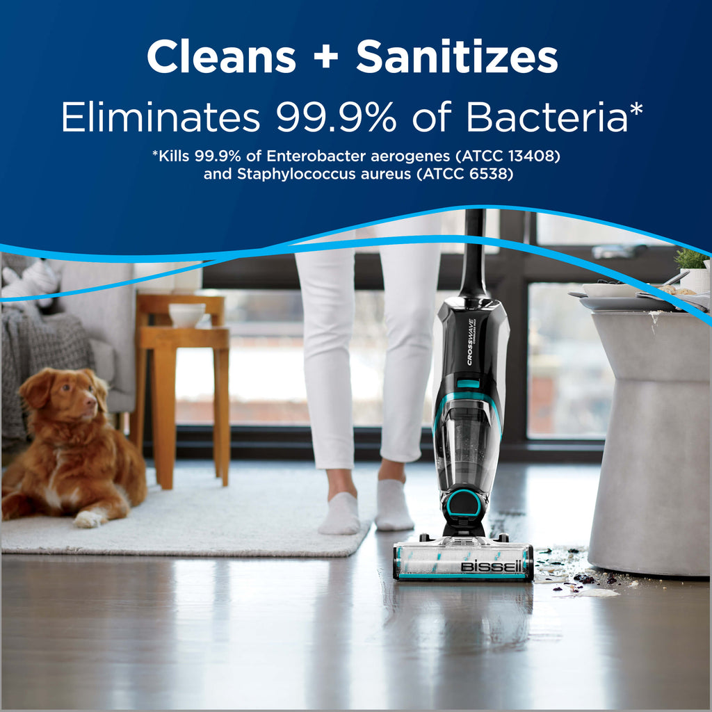Cleaning hard floor. Text: Cleans + Sanitizes
                        Eliminates 99.9% of Bacteria.
