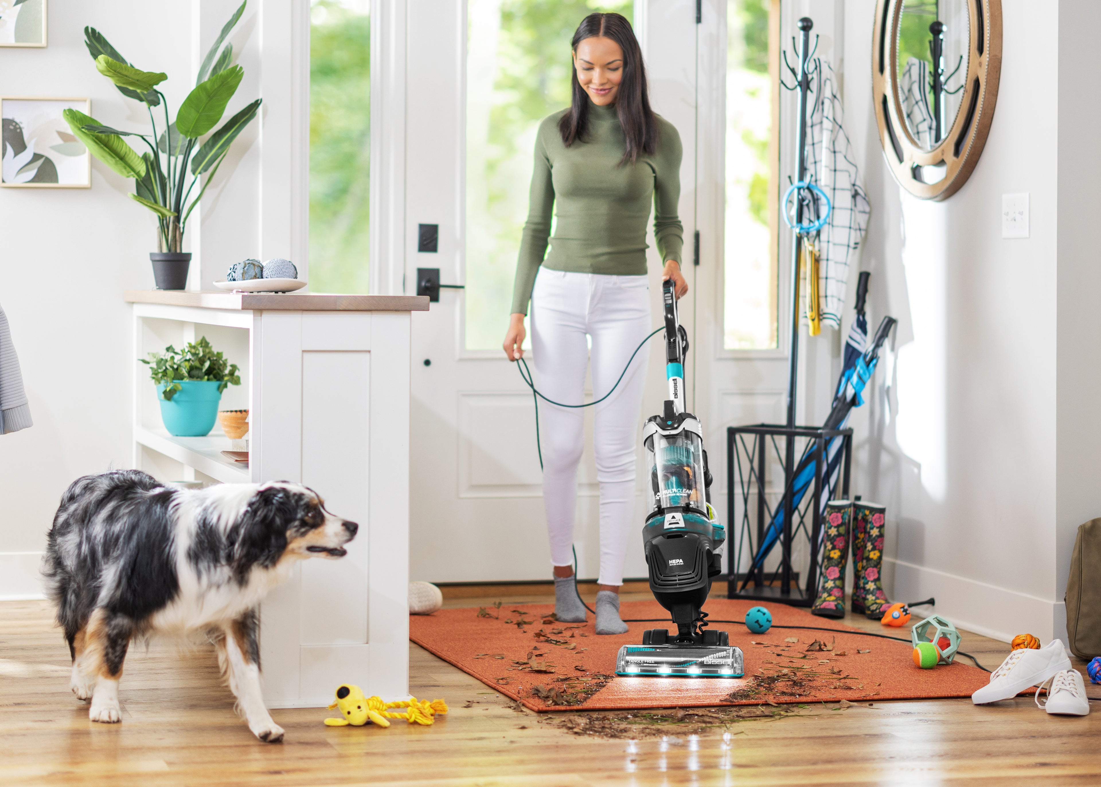 MultiClean Allergen Pet Vacuuming entry way with dog walking by.