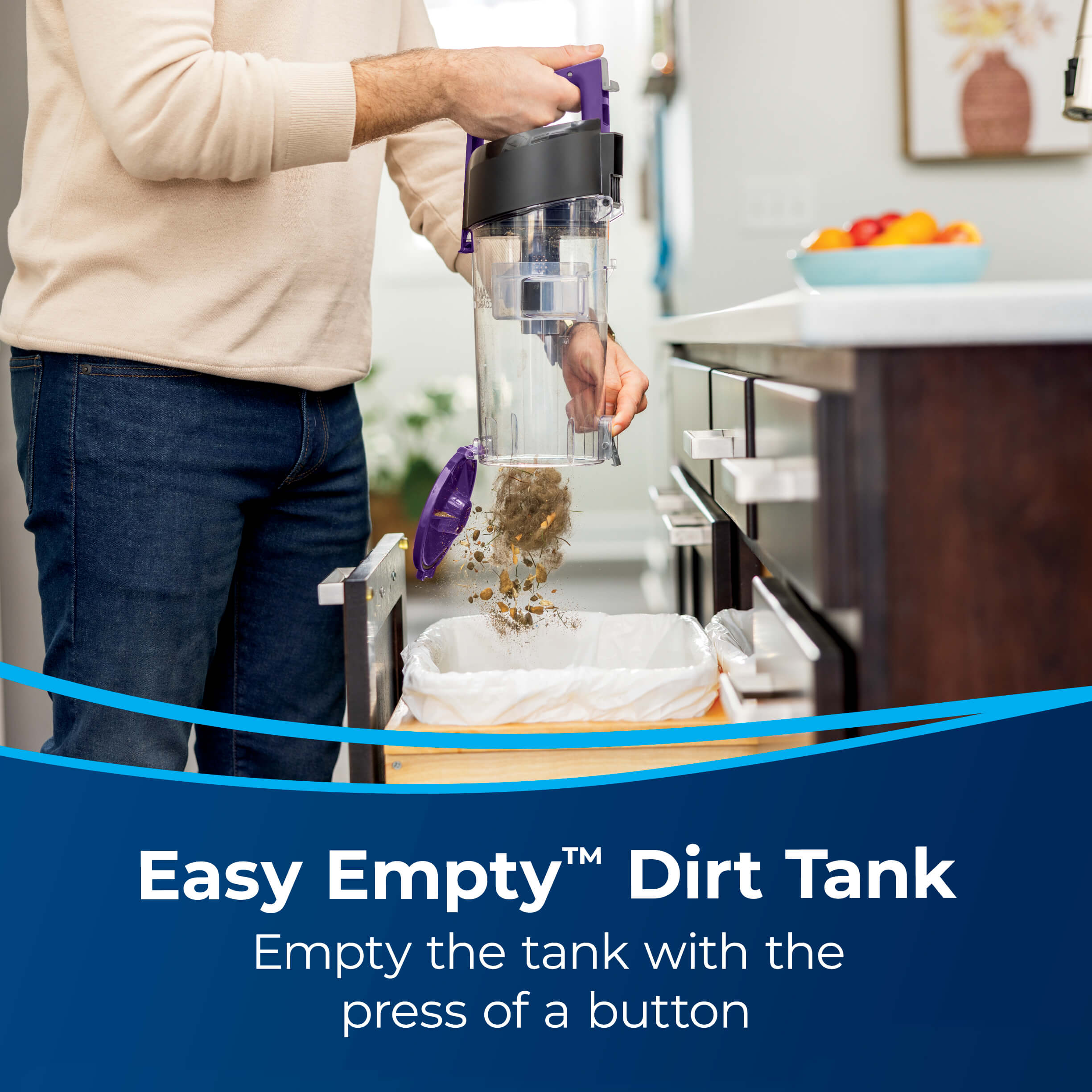 Emptying Dirt from Dirt Tank into Trash. Text: Easy
                        Empty Dirt Tank Empty the tank with the press of a button