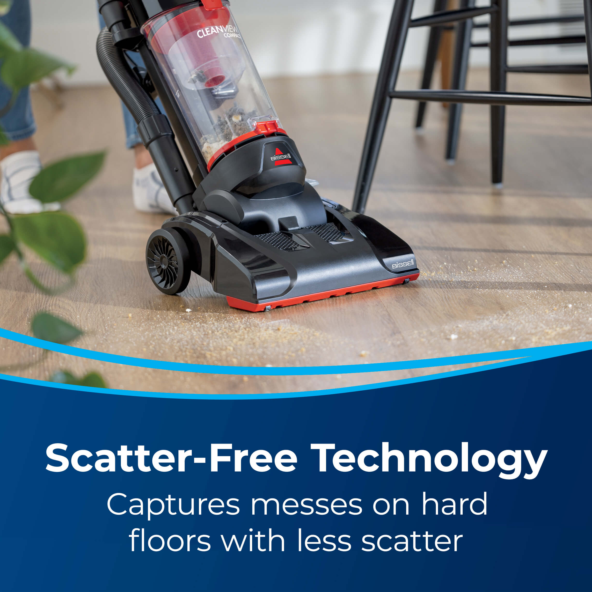 CleanView Compact Vacuuming spill on hard floor. Text:
                        Scatter-Free Technology Captures messes on hard floors with less scatter