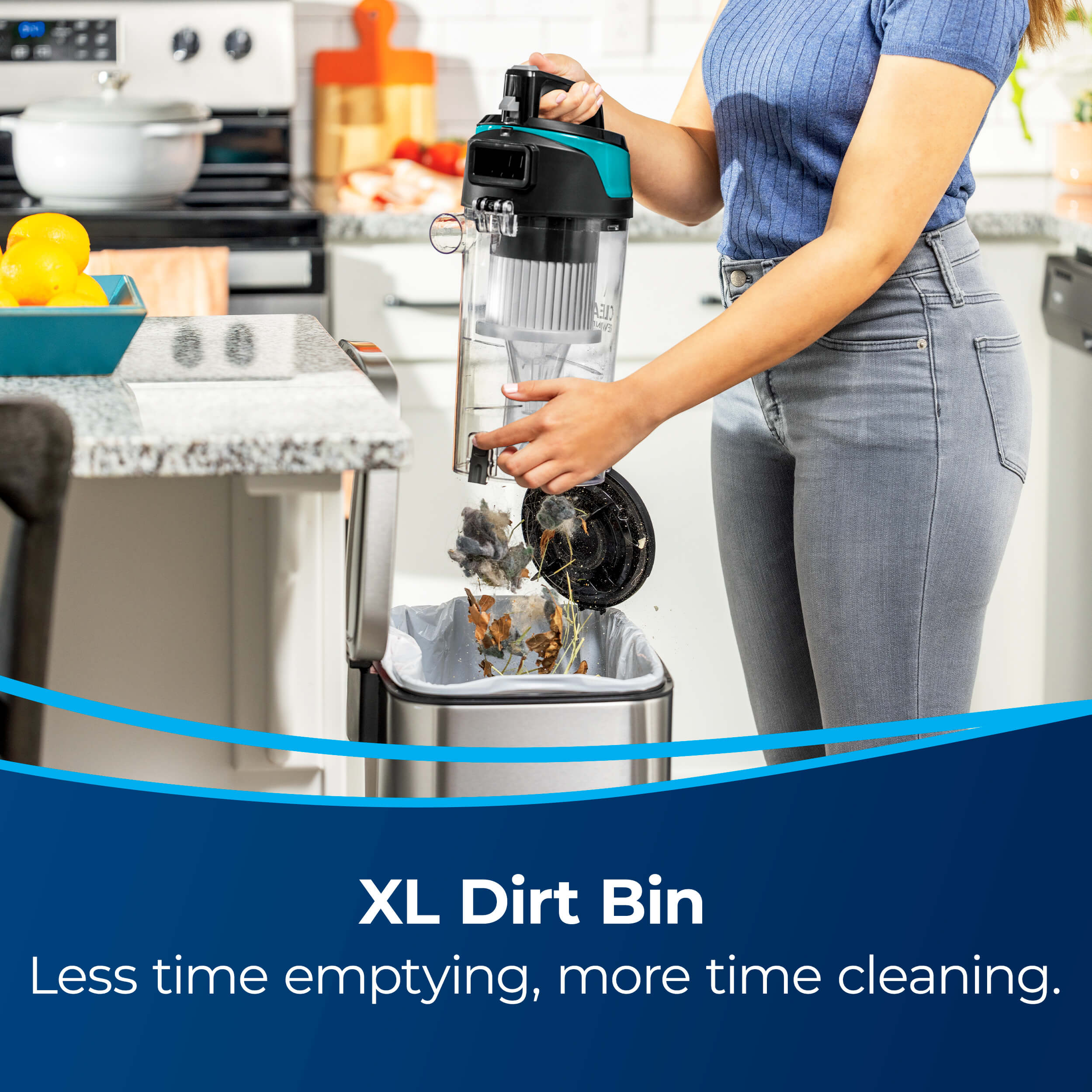Emptying Dirt Bin in Trash. Text: XL Dirt Bin Less
                        Emptying, more Time Cleaning