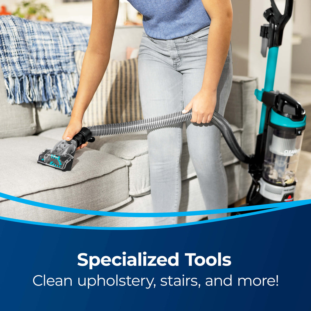 Using TurboBrush Tool on hose to vacuum couch cushion.
                        Text: Specialized Tools Clean Upholstery, stairs, and more!