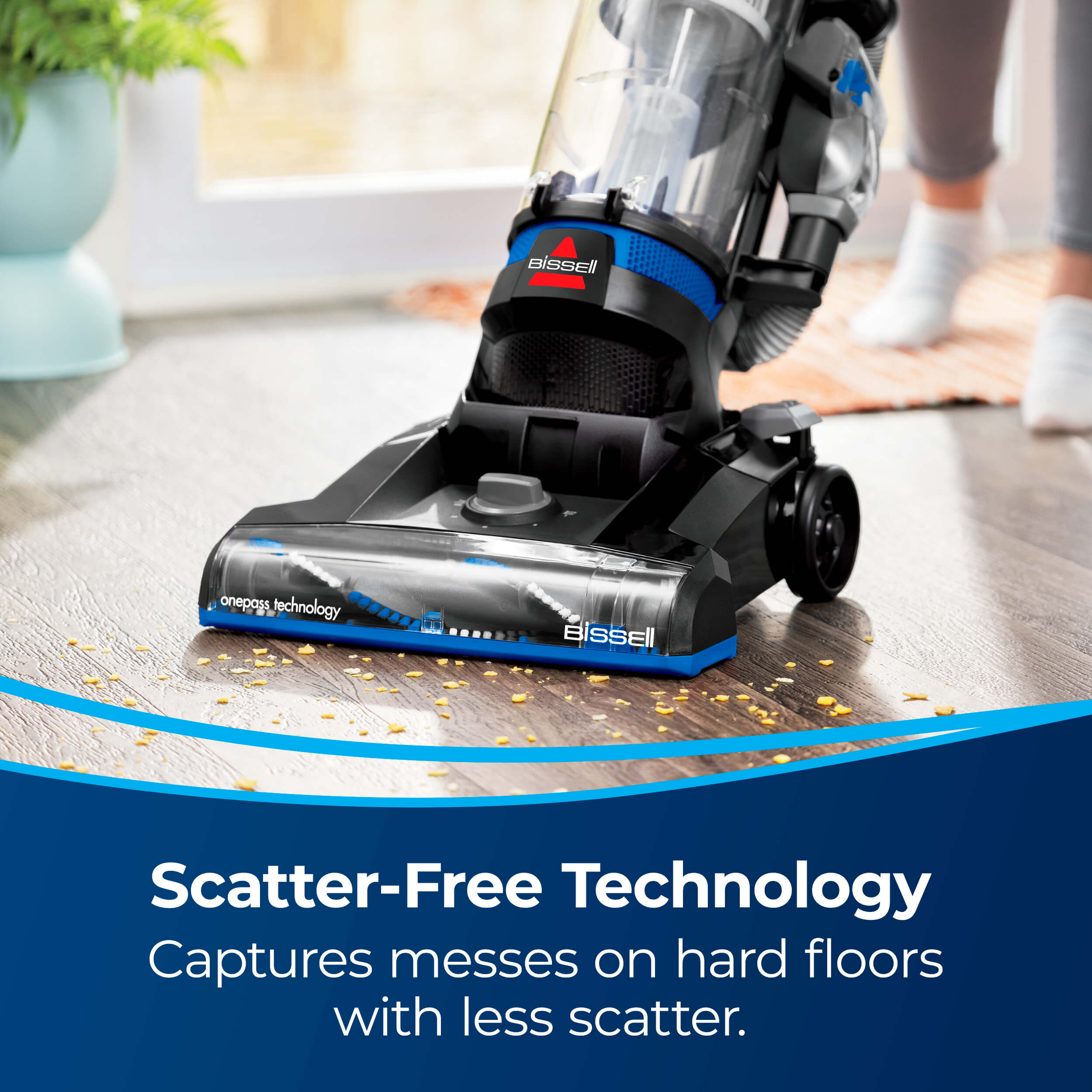 CleanView Vacuuming debris from hard flooring. Text:
                        Scatter-Free Technology Captures messes on hard floors with less scatter