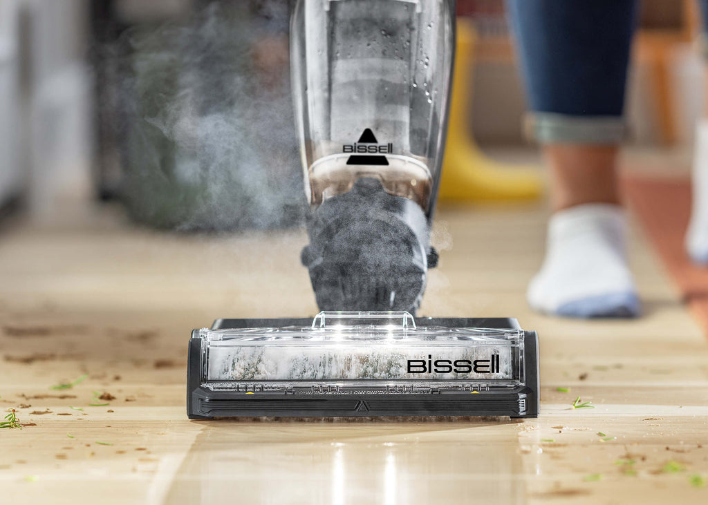 CrossWave HydroSteam vacuuming and mopping dirt from
                        hard flooring