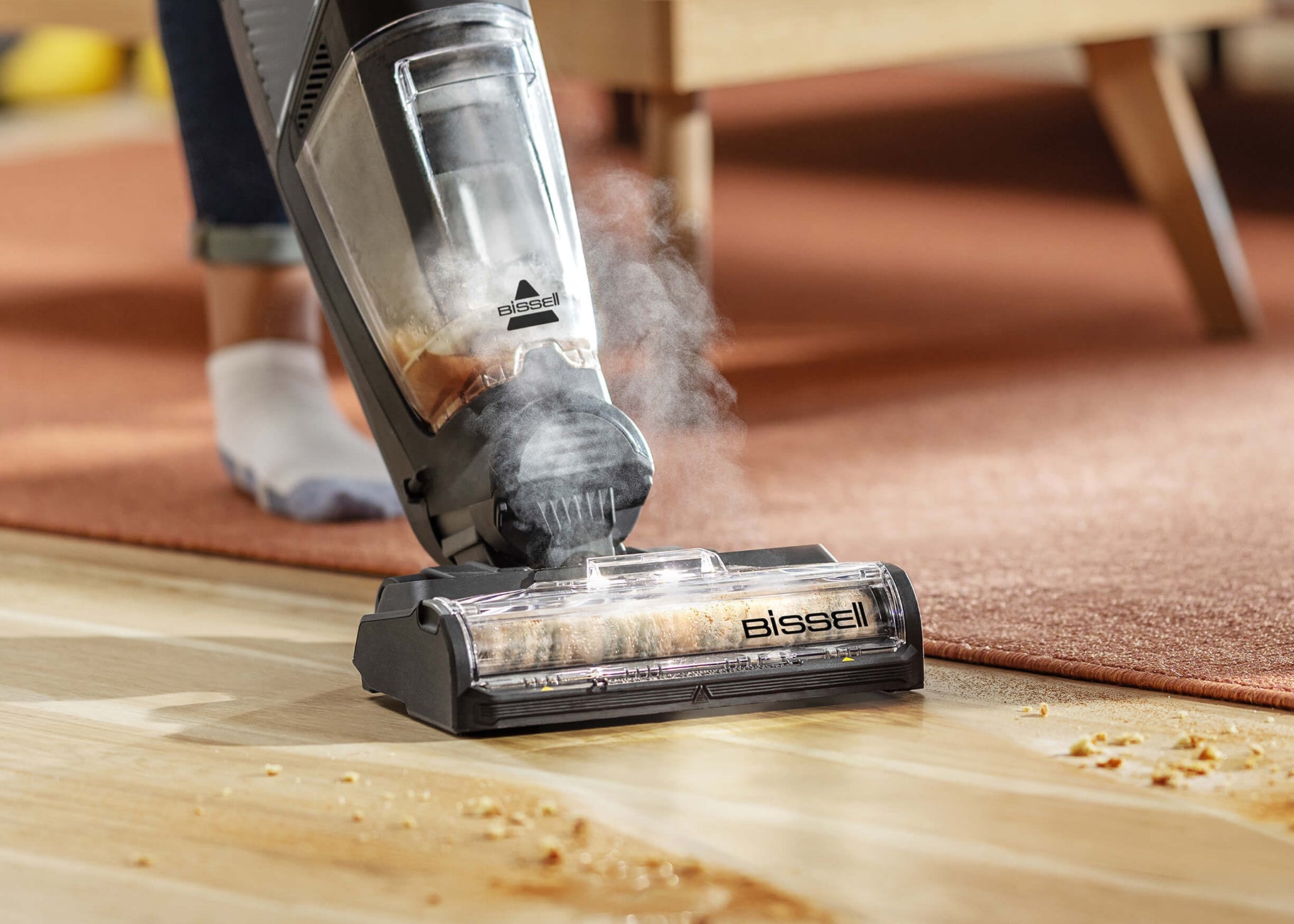 CrossWave HydroSteam vacuuming and mopping spill on
                        sealed wood floors