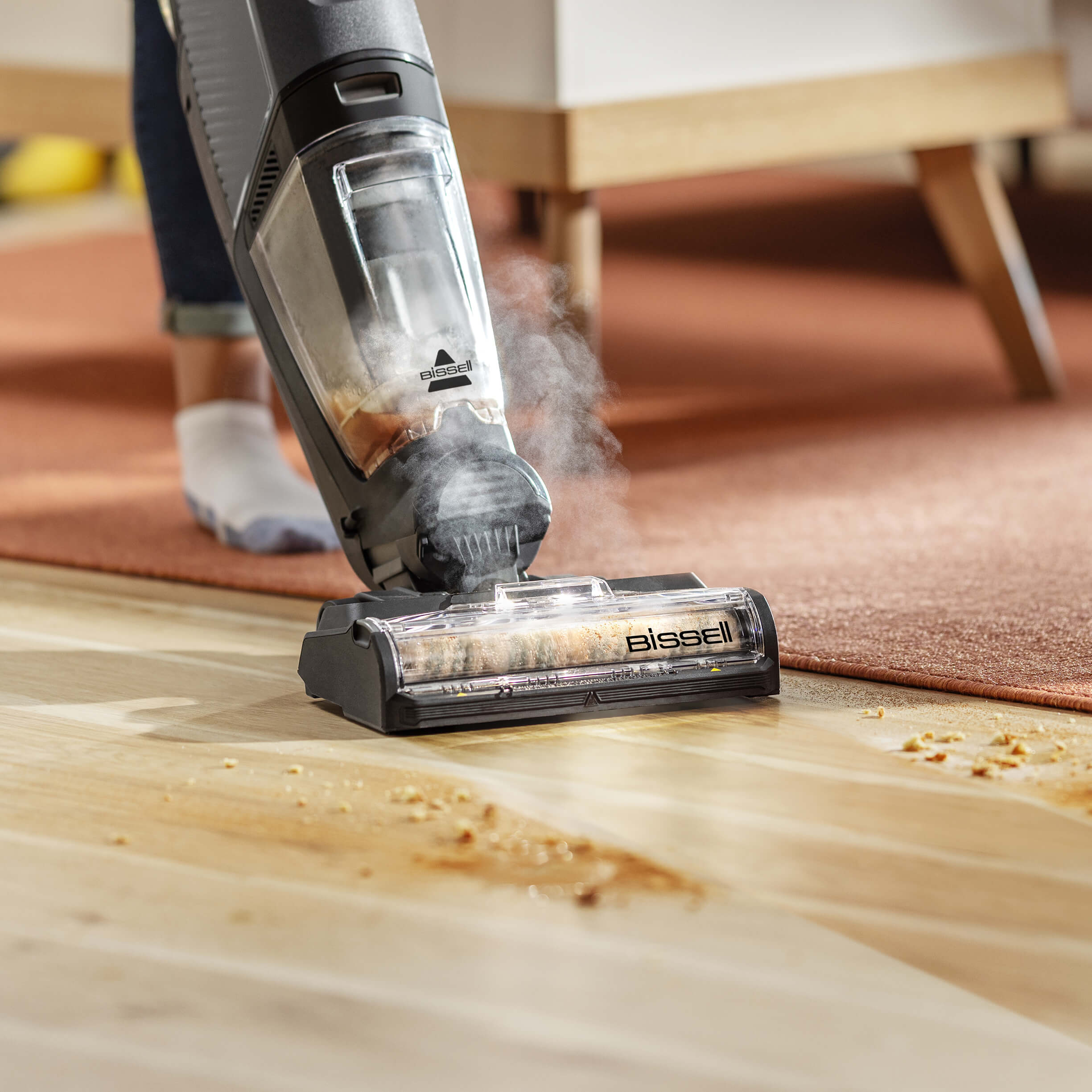 CrossWave HydroSteam vacuuming and mopping spill on
                        sealed wood floors