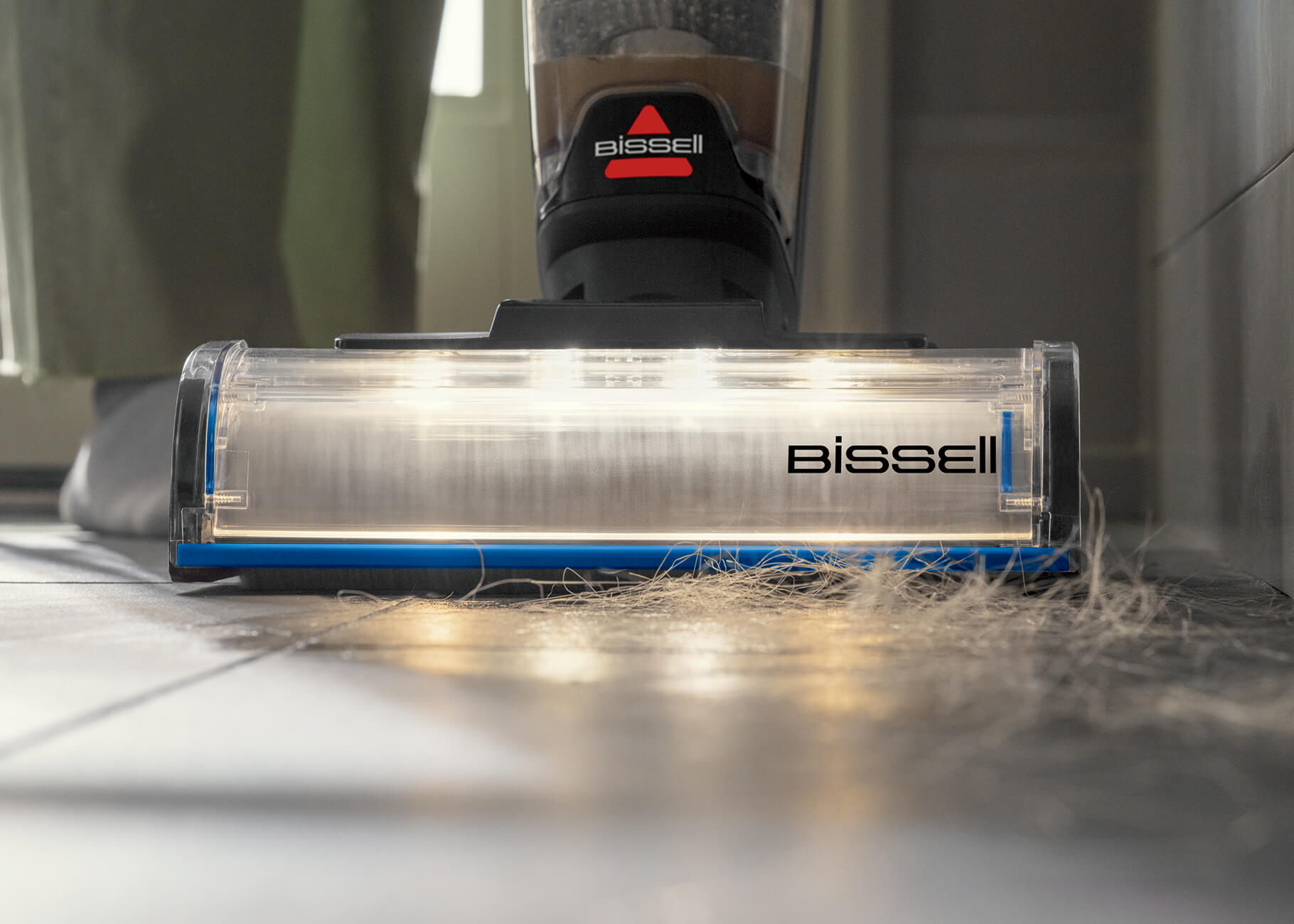 CrossWave OmniFind vacuuming hair off floors.
