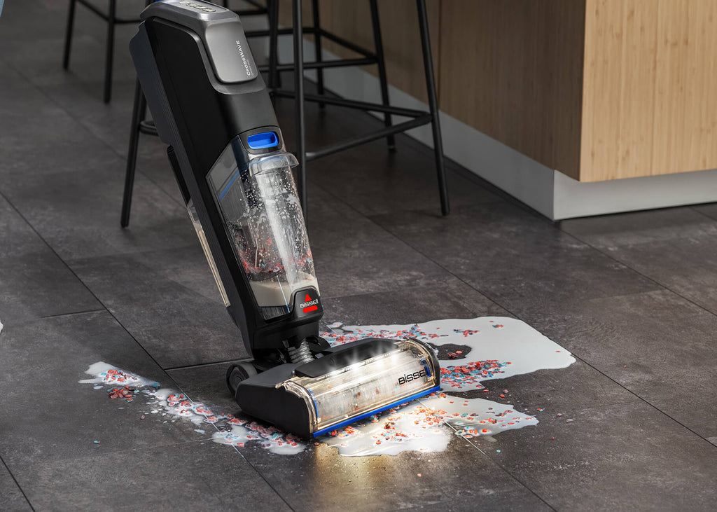 CrossWave OmniFind vacuuming and mopping wet spill on
                        hard flooring.