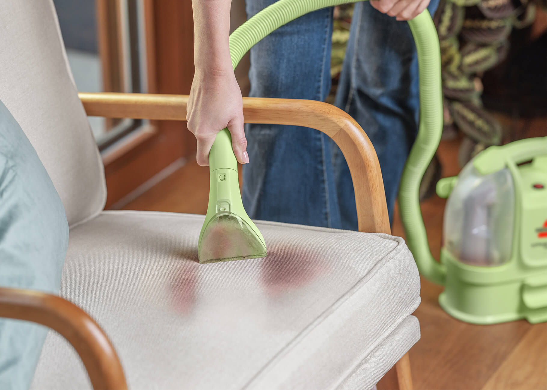Using Little Green Mini to clean stain on chair upholstery