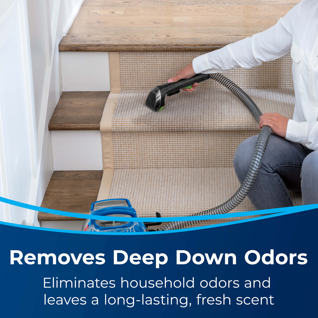 Using Portable Machine to clean Carpet on Stairs.
                        Text: Removes Deep Down Odors. Eliminates household odors and leaves a
                        long-lasting, fresh scent