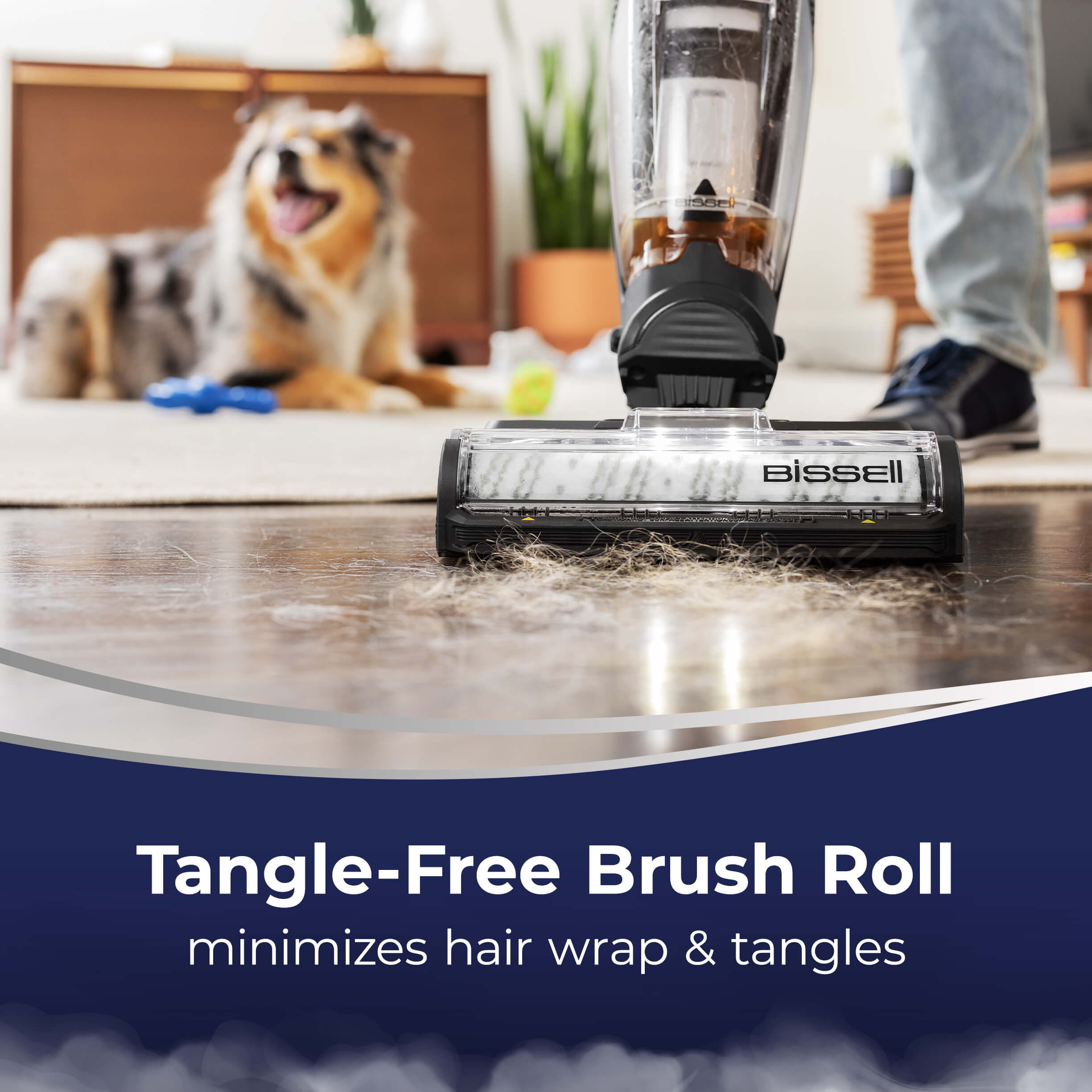 CrossWave HydroSteam picking up pet hair from hard
                        flooring. Text: Tangle-Free Brush Roll helps minimize hair wrap