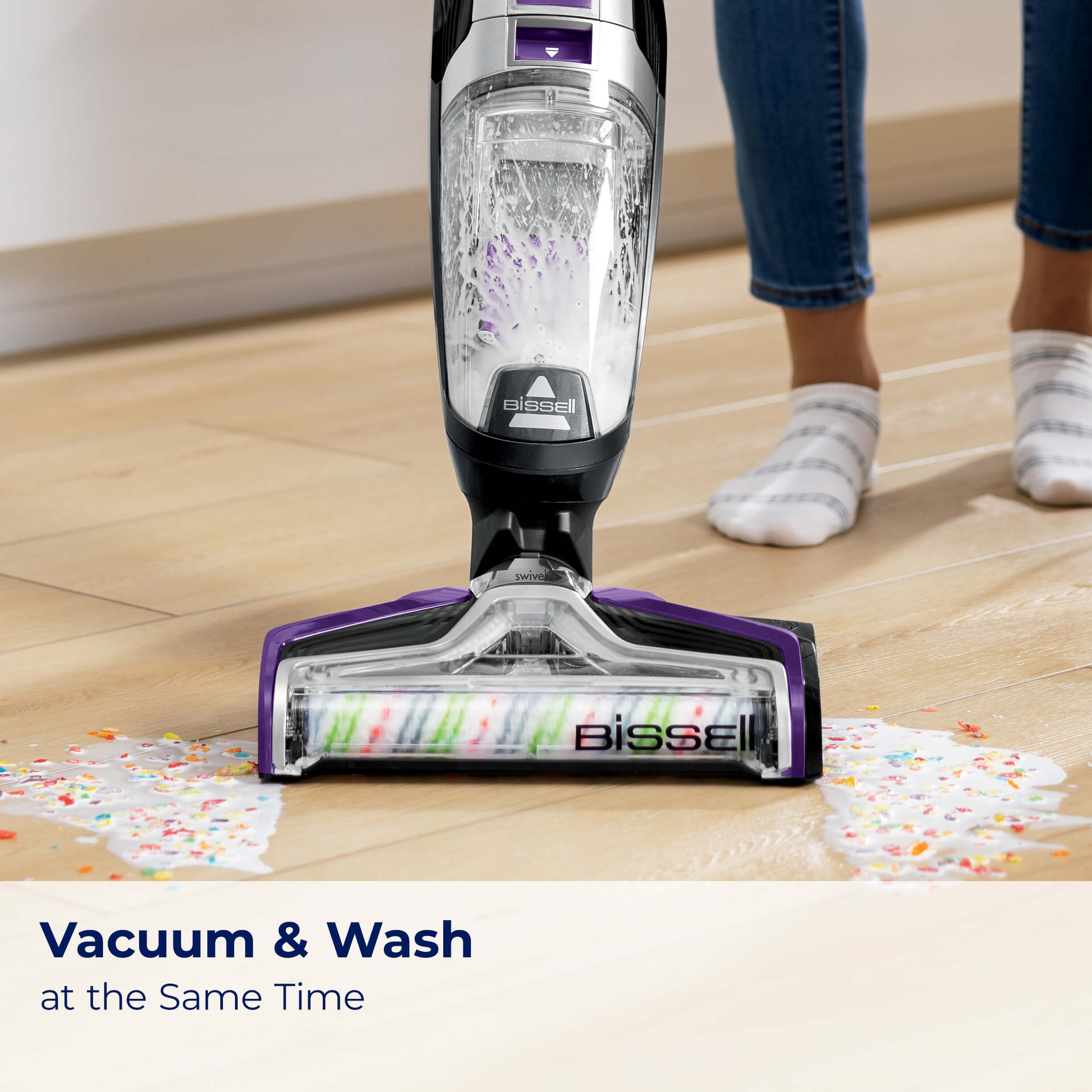 CrossWave Pet Pro washing and picking up spilled milk
                        from hard flooring. Text: Vacuum & Wash at the same time