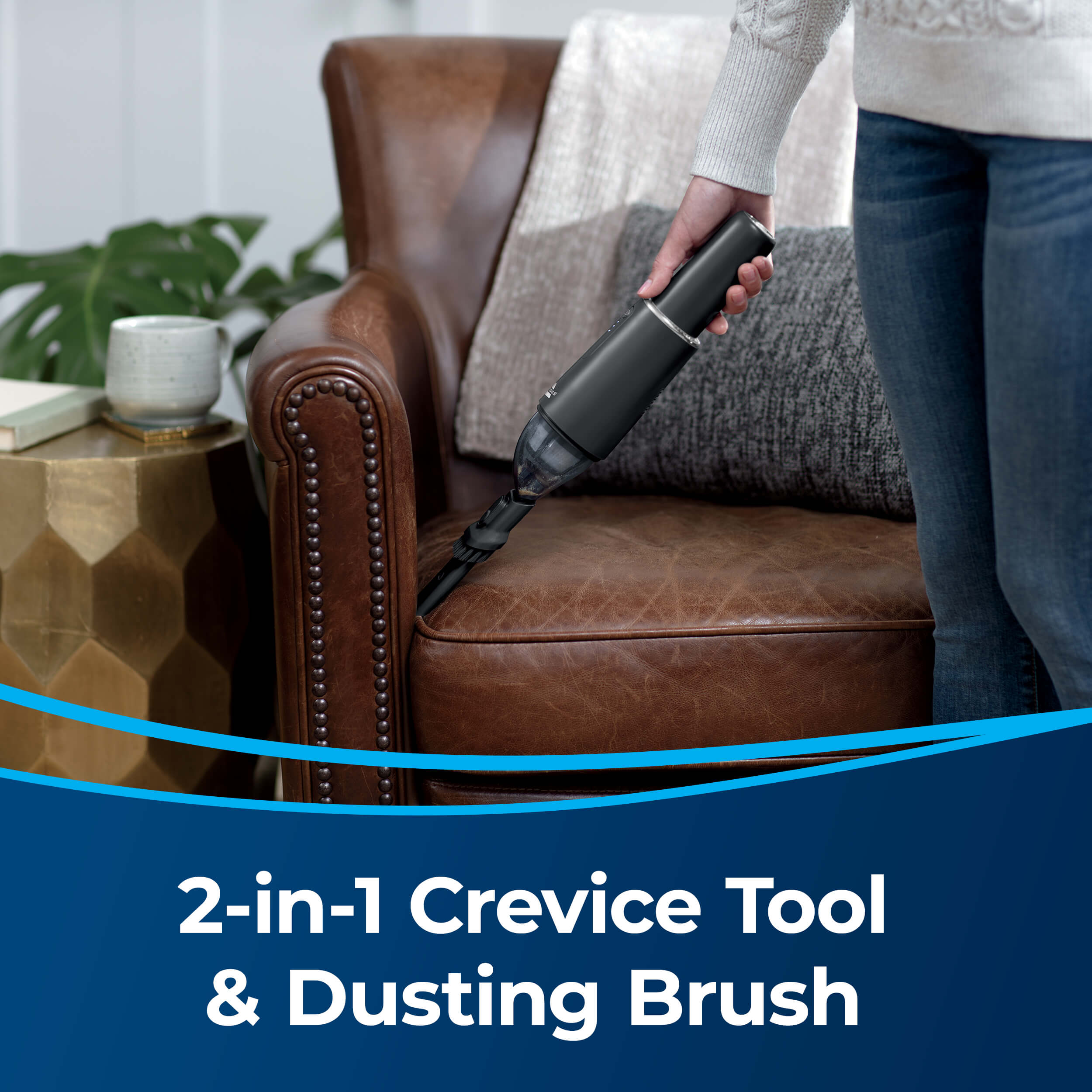 Woman Using AeroSlim Handheld Vac Crevice Tool to
                        Clean Between Couch Cushions. Text: 2-in-1 Crevice Tool & Dusting Brush
