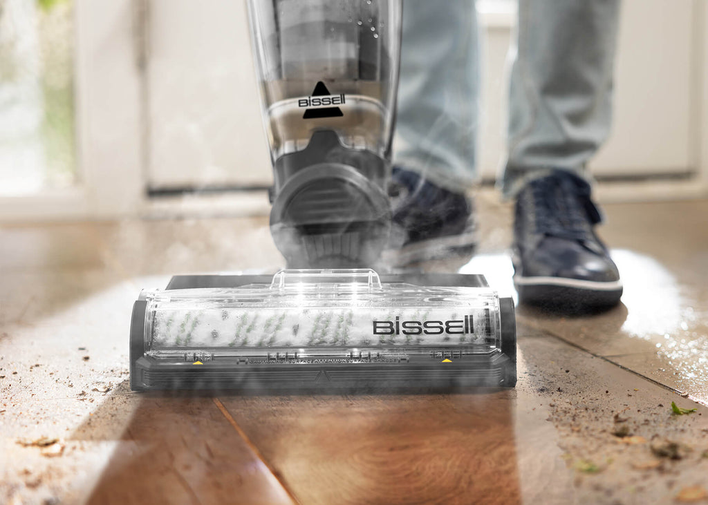 CrossWave HydroSteam vacuuming and mopping dirt from hard floors