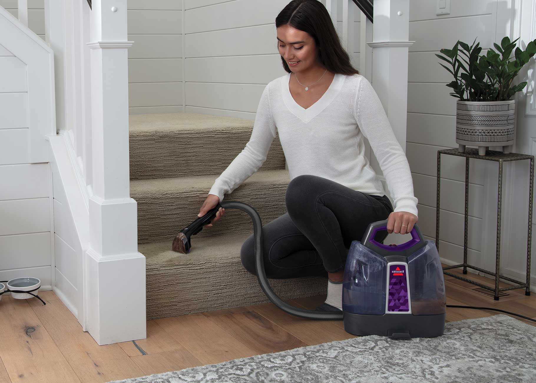 Cleaning stairs with upholstery tool