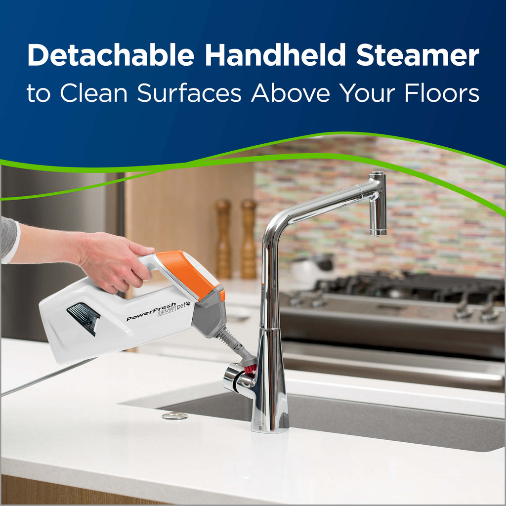 Powerfresh Pet Lift-Off Steam Mop Using Hand Steamer
                        on Kitchen Sink. Text: Detachable Handheld Steamer to Clean Surfaces Above
                        Your Floors