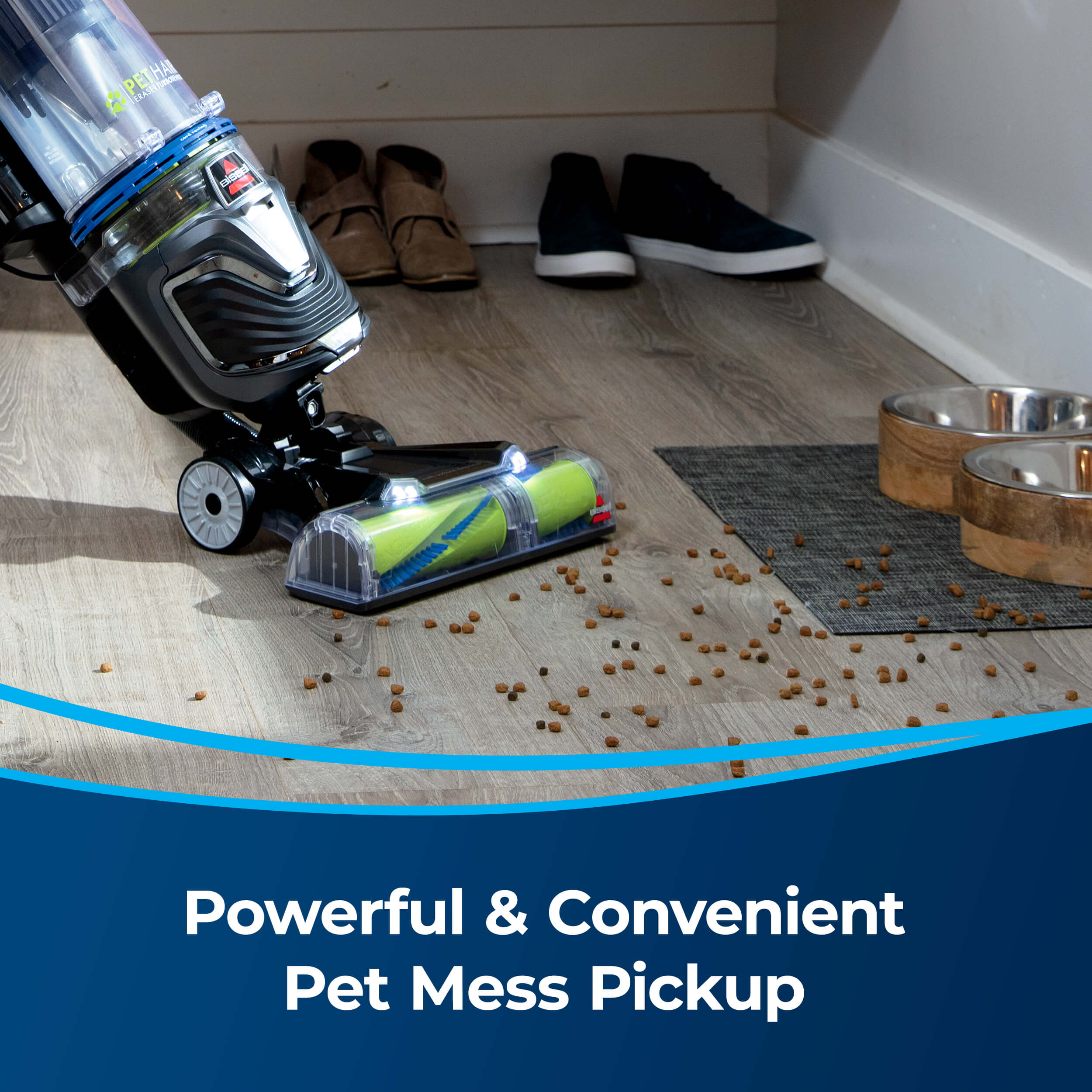 Pet Hair Eraser Turbo Rewind Vacuum picking up dog
                        food from hard flooring. Text: Powerful & Convenient Pet Mess Pickup