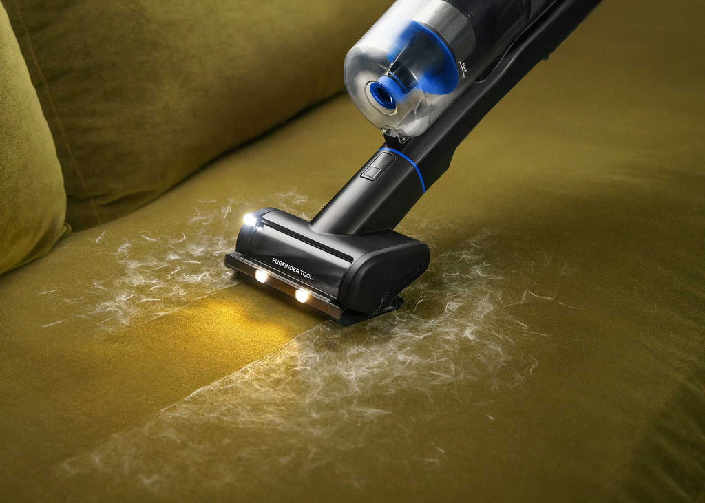 Using FurFinder Lighted Upholstery Tool to vacuum pet hair from upholstery