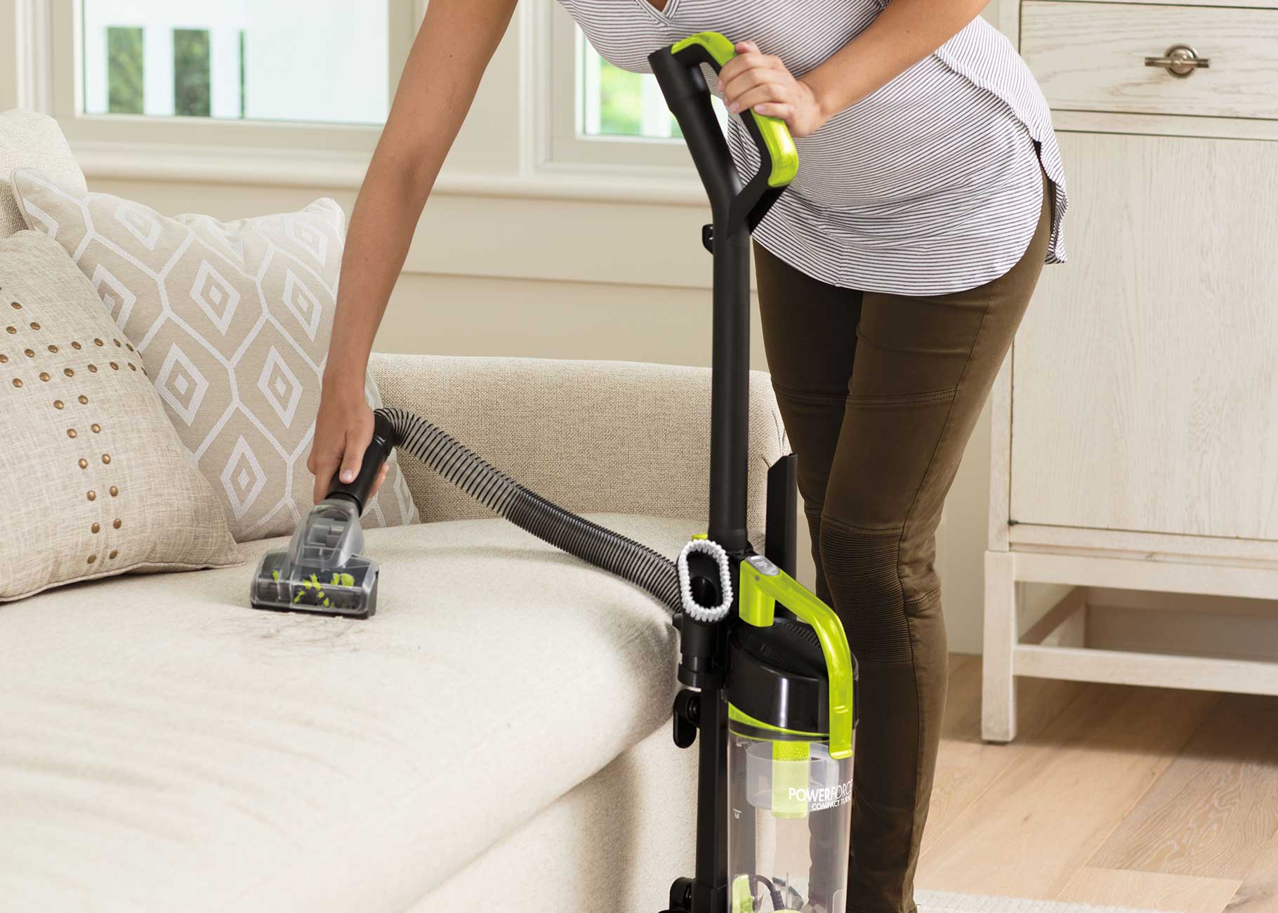 Using tool on hose to vacuum upholstery