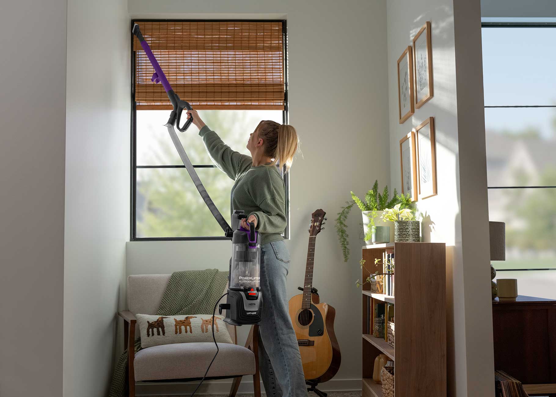 Using extension wand to clean above floors