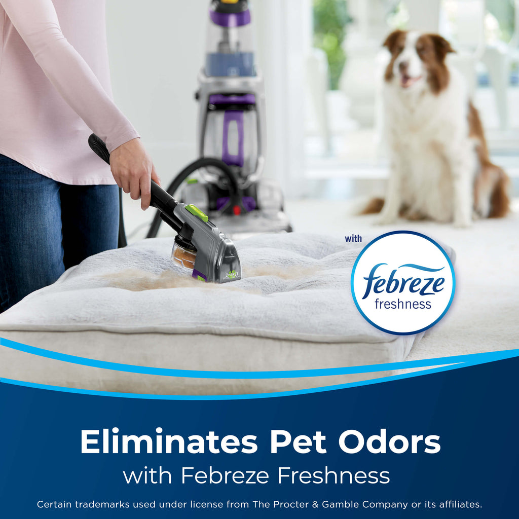 Using hose of upright carpet cleaner with attachment
                        to clean pet bed. Text: Eliminates Pet Odors with Febreze Freshness