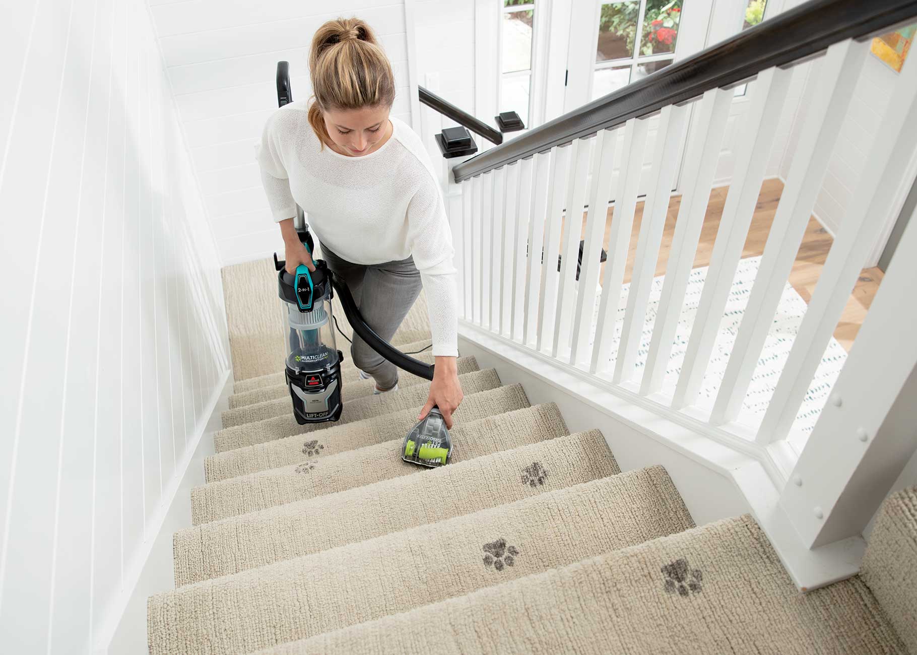 MultiClean Allergen Lift Off Pet Vacuum Cleaner using hose to vacuum stairs